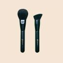 Two Sophiana makeup brushes with black handles - a round powder brush and an angled contour brush on beige background
