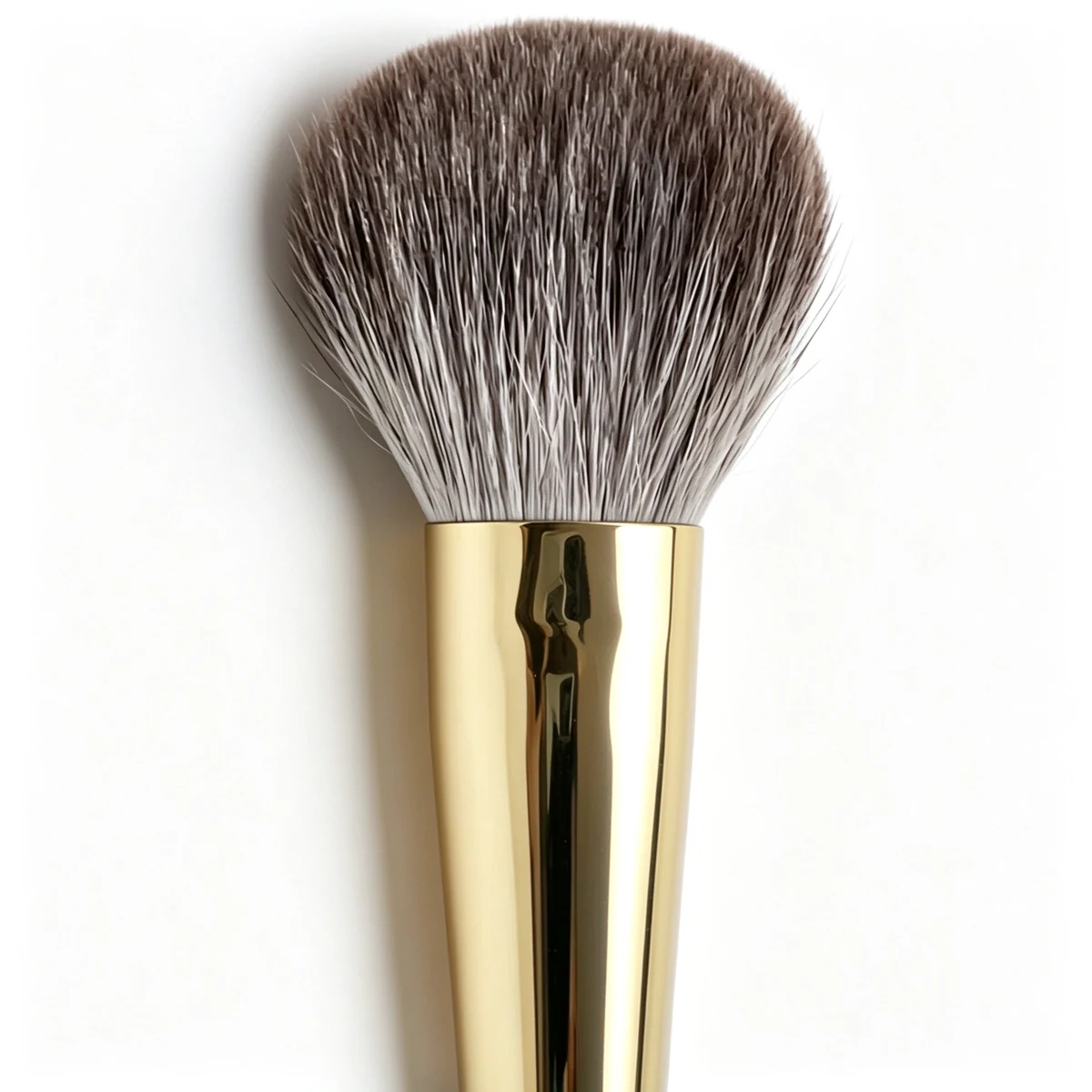 Close-up of powder brush head and gold ferrule