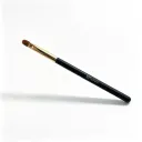 Flat concealer brush at a 45-degree angle